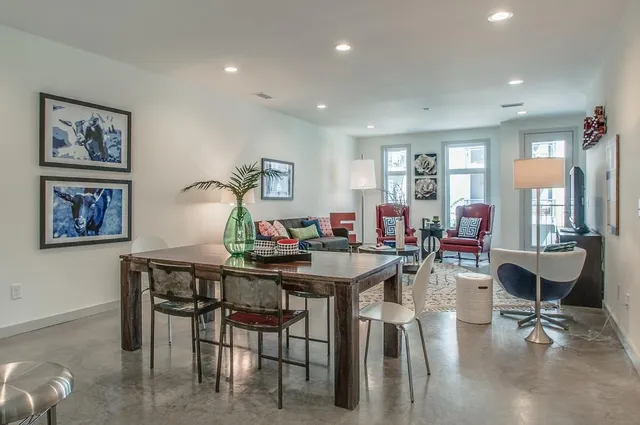 a view of a dining room with furniture and a livingroom