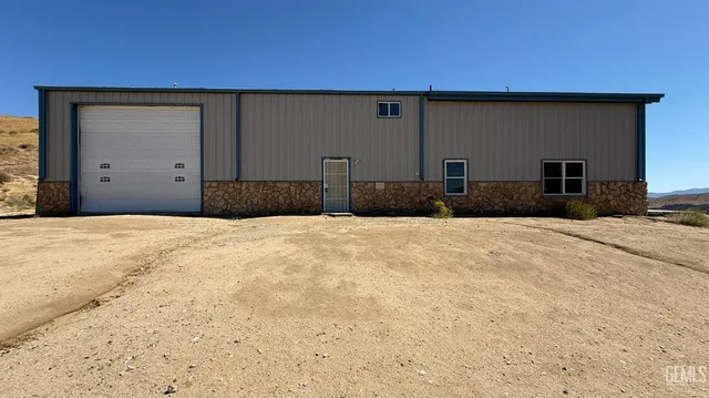 a view of backyard of a house