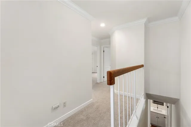 an empty room with large windows