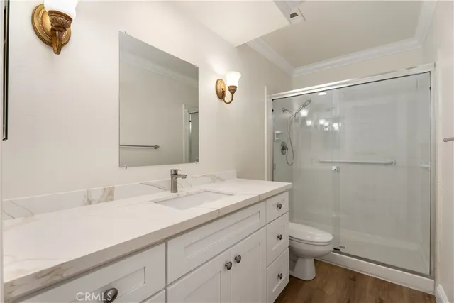 an empty room with a cabinet and mirrors