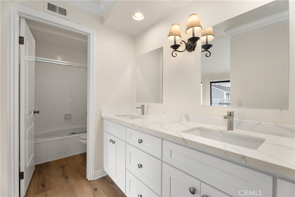3 Kamalii Court, Unit 276 Newport Beach, CA 92663 - Photo 25 of 28 a bathroom with a sink vanity and a mirror