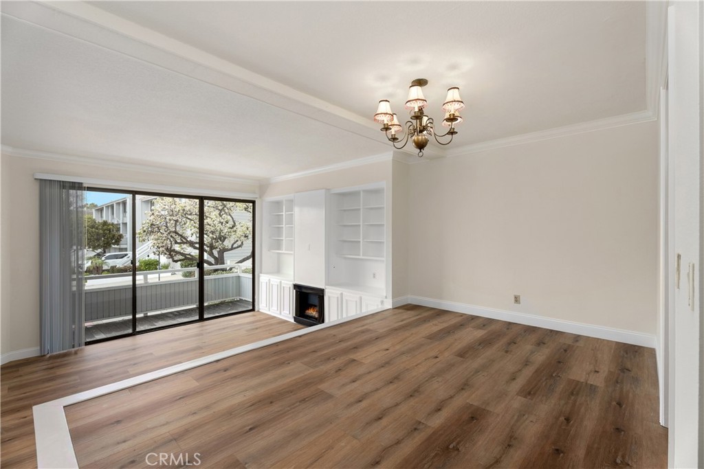 3 Kamalii Court, Unit 276 Newport Beach, CA 92663 - Photo 9 of 28 a view of empty room with wooden floor and fan