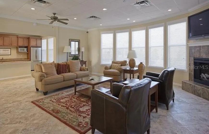 7879 Southwest 80th Drive Gainesville, FL 32608 - Photo 16 of 23 a living room with fireplace furniture and a large window