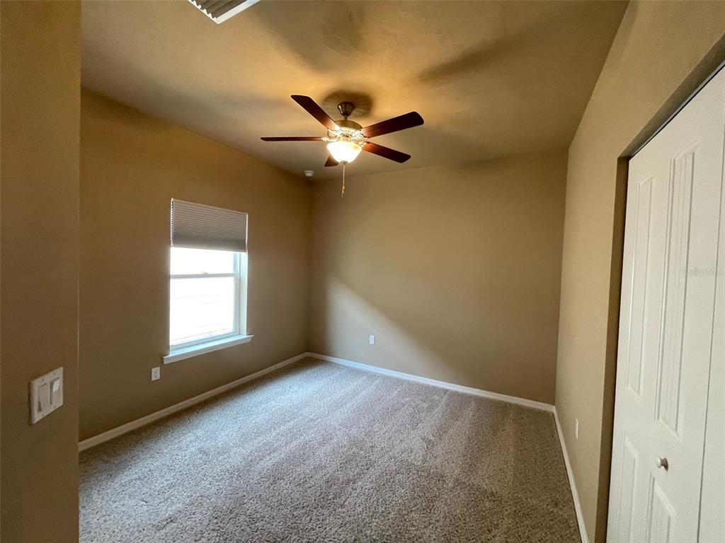 7879 Southwest 80th Drive Gainesville, FL 32608 - Photo 8 of 23 a view of an empty room with a window