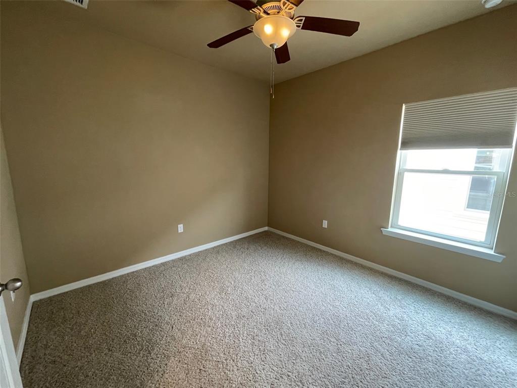 7879 Southwest 80th Drive Gainesville, FL 32608 - Photo 9 of 23 an empty room with a window