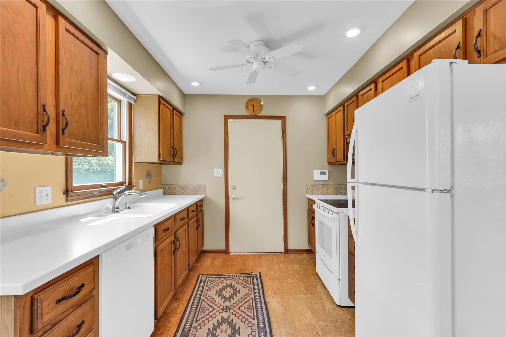 1506 Harrington Drive Champaign, IL 61821 - Photo 12 of 37 a kitchen with a sink appliances and cabinets