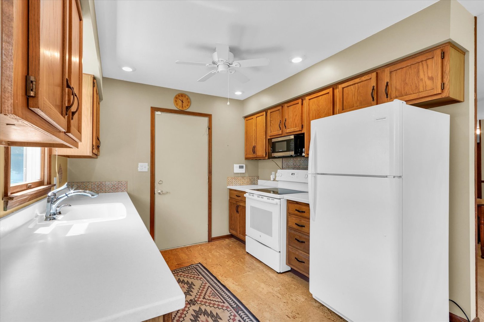 1506 Harrington Drive Champaign, IL 61821 - Photo 13 of 37 a kitchen with stainless steel appliances a refrigerator a sink a stove top oven a counter space and cabinets