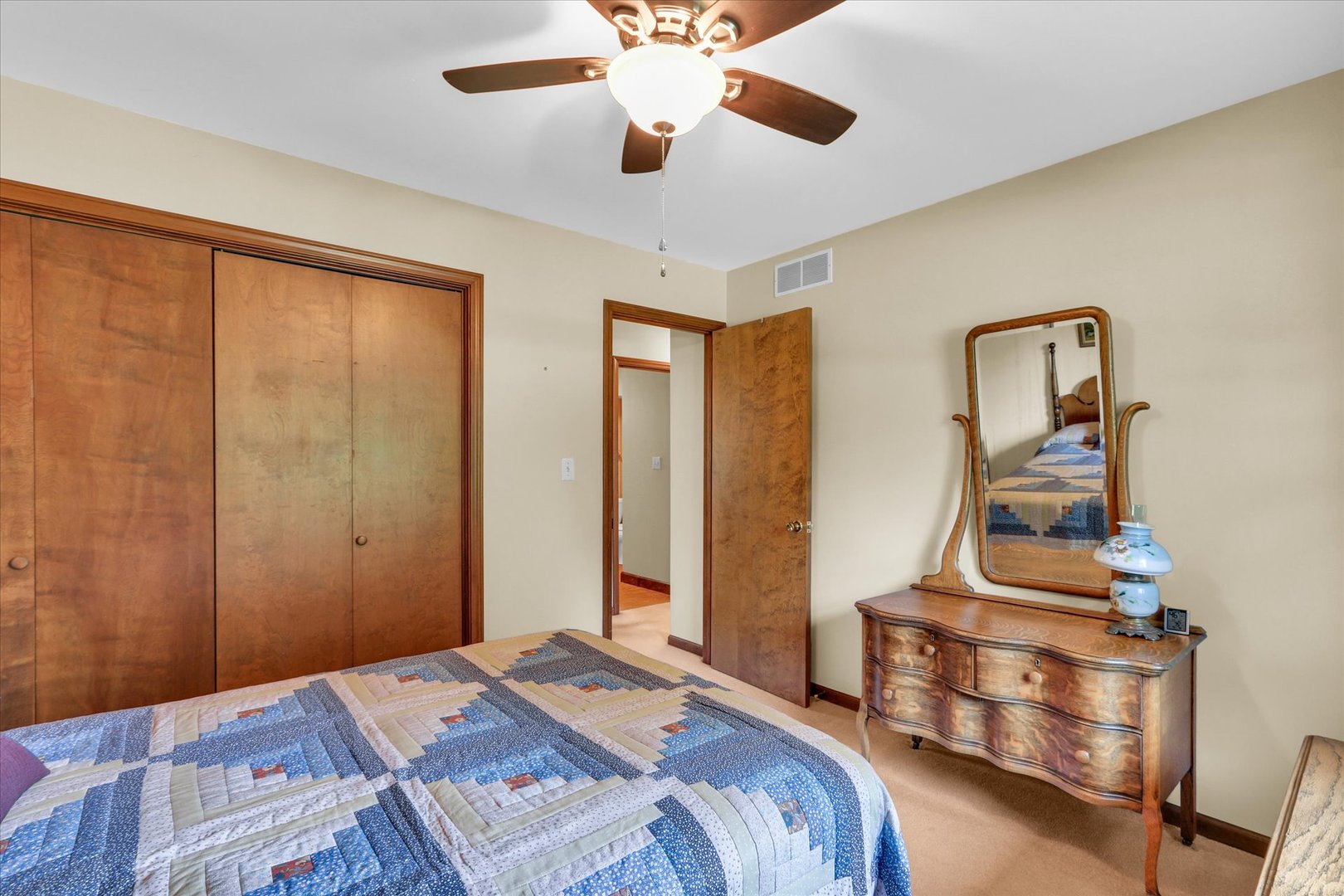 1506 Harrington Drive Champaign, IL 61821 - Photo 22 of 37 a bedroom with a bed and a chandelier