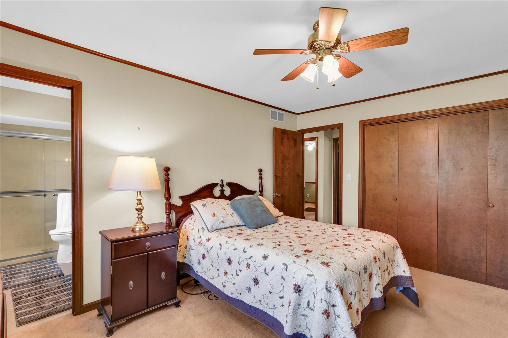 1506 Harrington Drive Champaign, IL 61821 - Photo 24 of 37 a bedroom with a bed and a chandelier