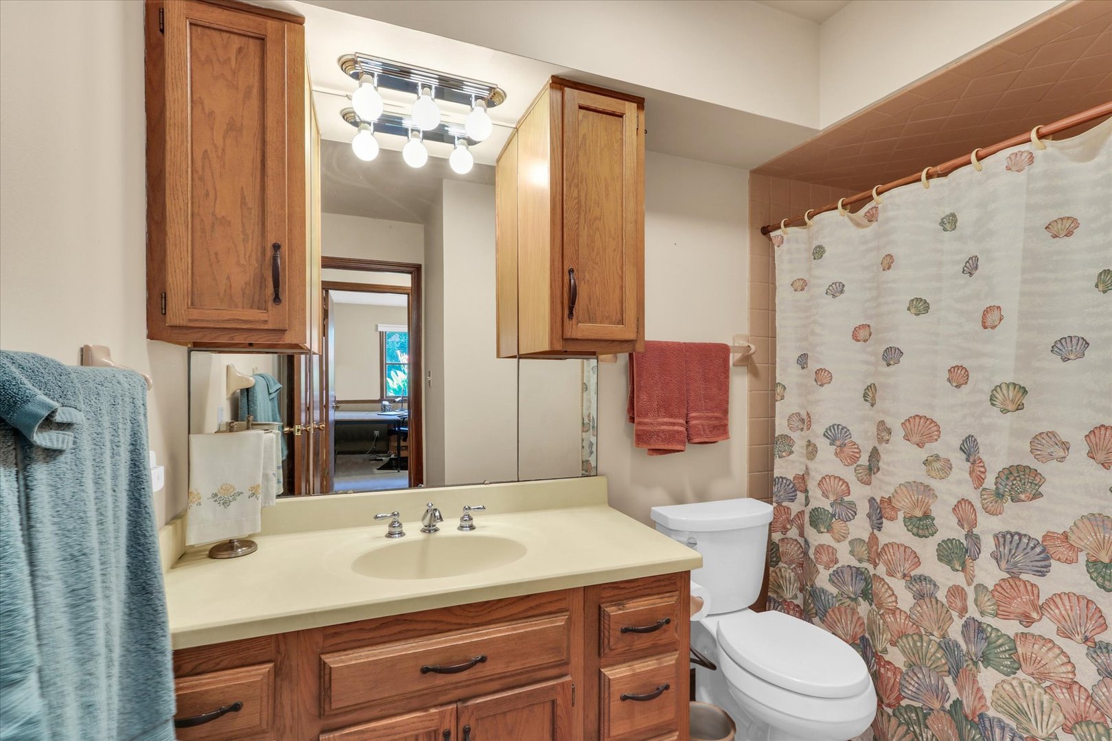 1506 Harrington Drive Champaign, IL 61821 - Photo 26 of 37 a bathroom with a sink toilet vanity and shower