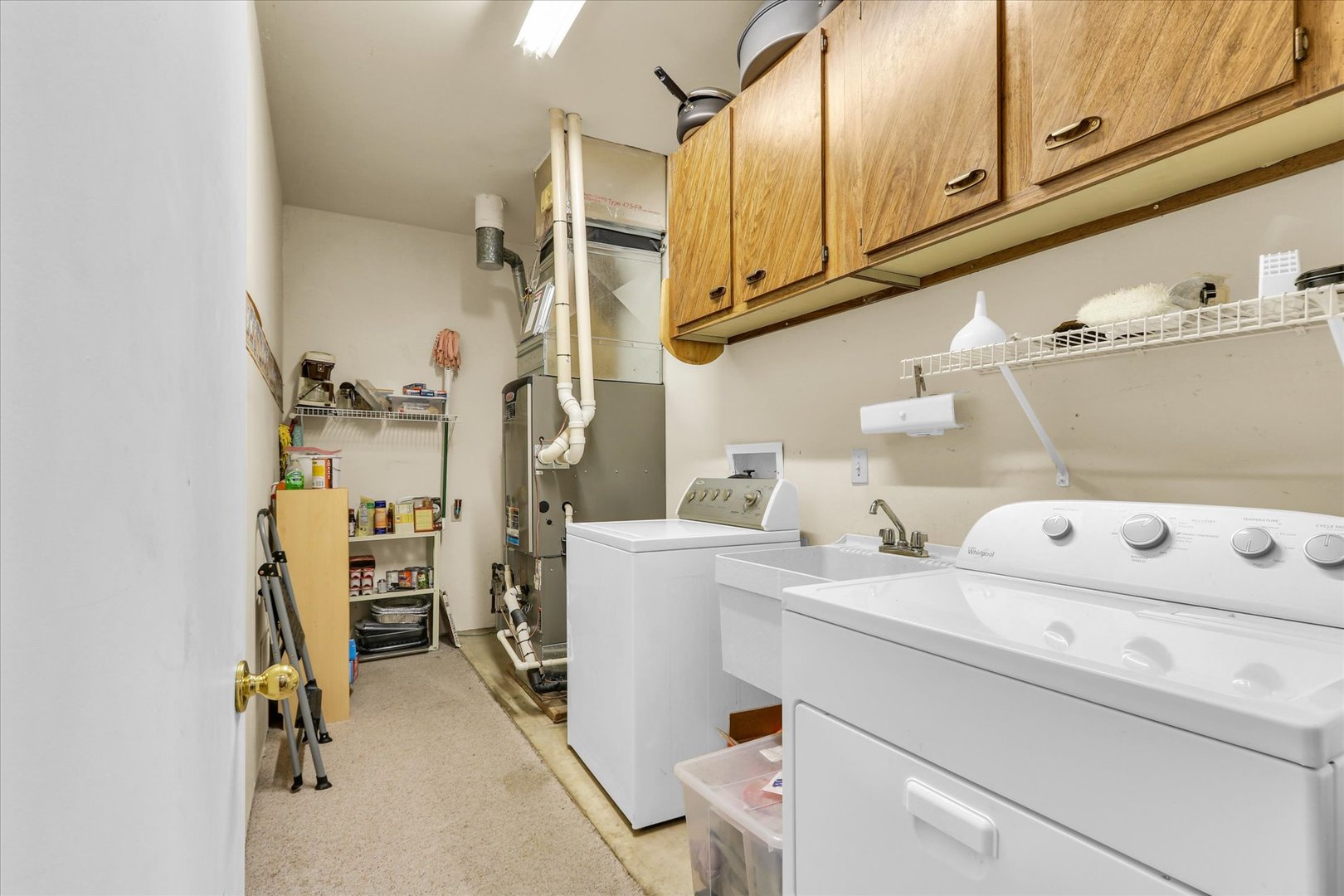 1506 Harrington Drive Champaign, IL 61821 - Photo 27 of 37 a view of storage and utility room with washer and dryer