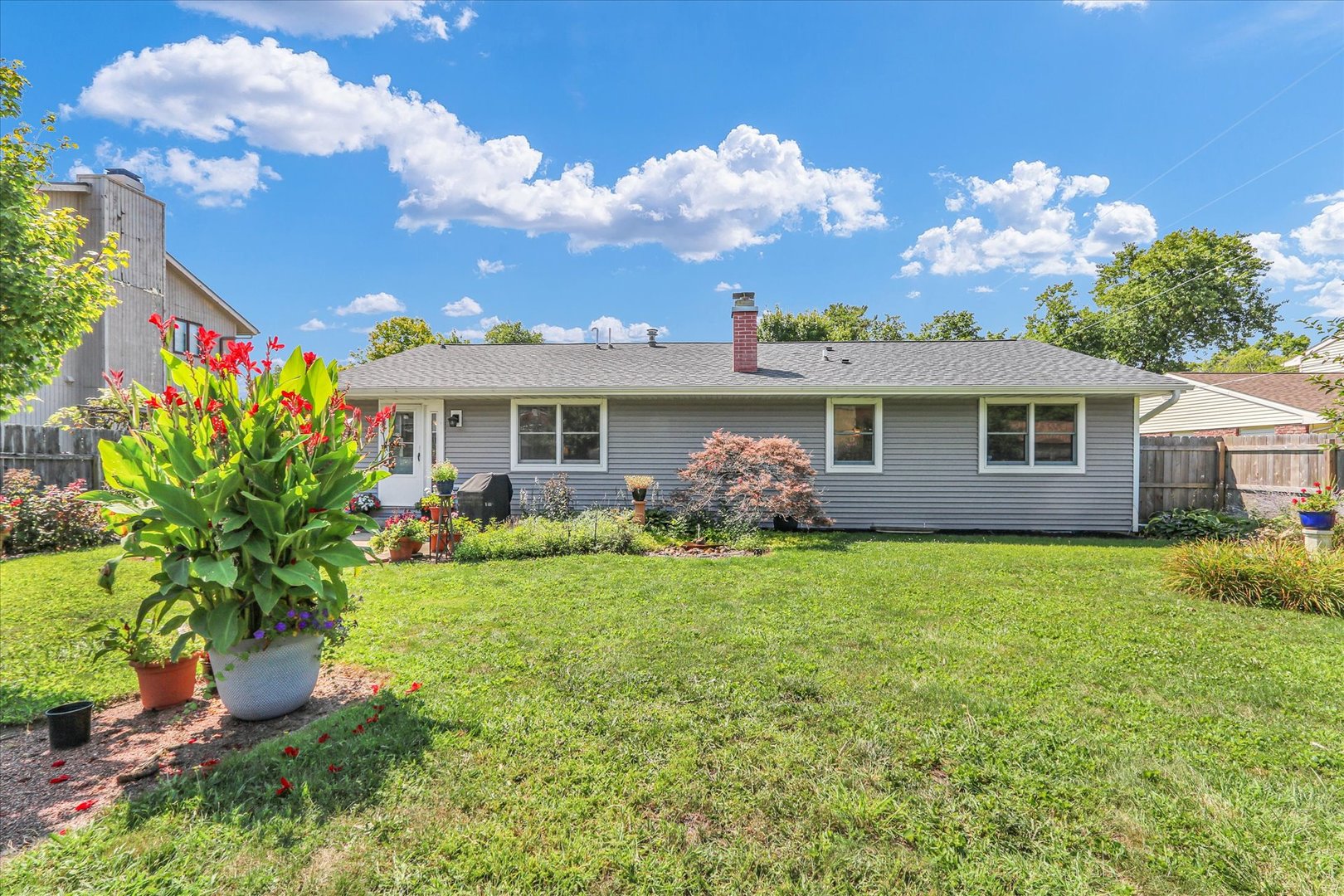 1506 Harrington Drive Champaign, IL 61821 - Photo 28 of 37 a front view of a house with garden