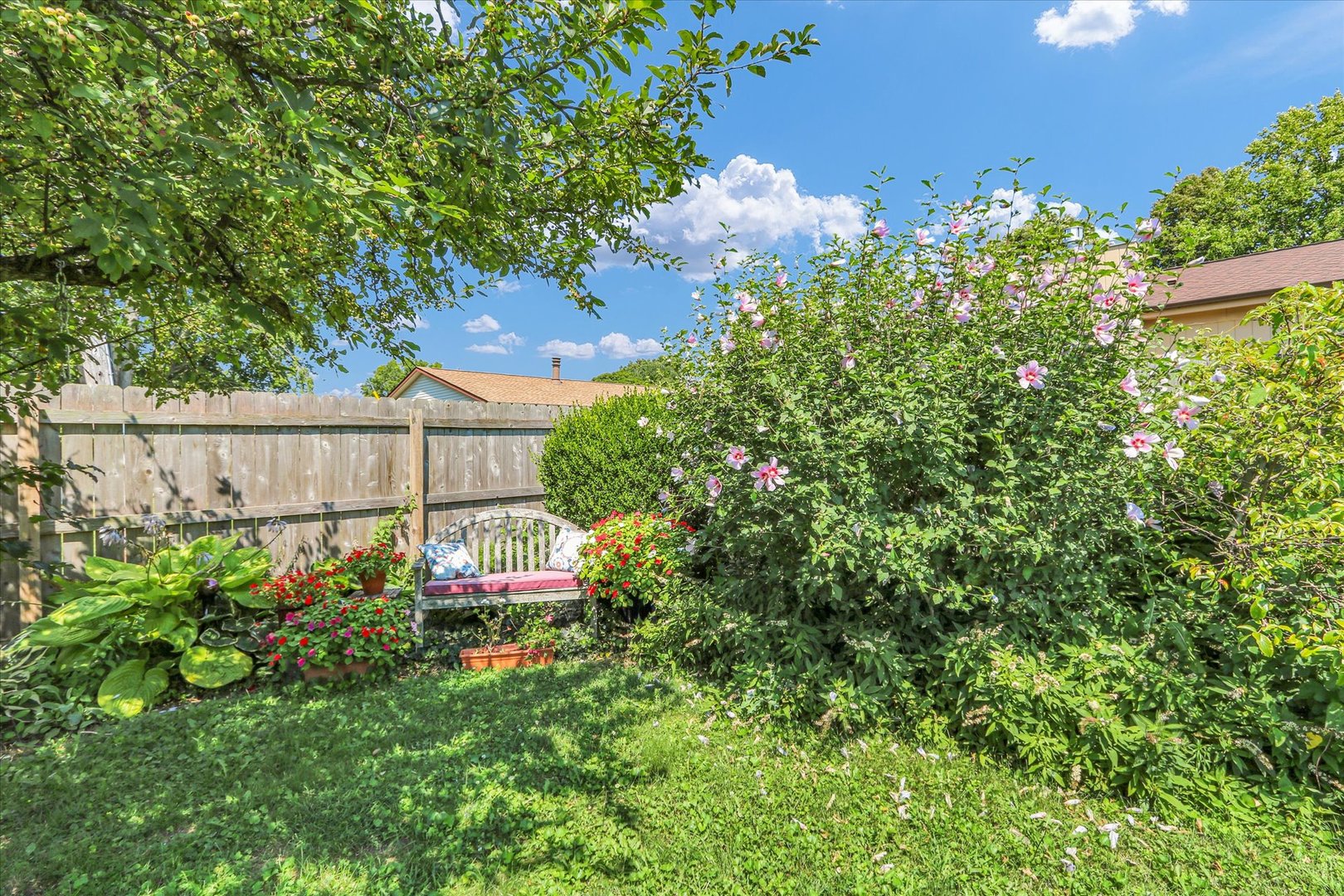 1506 Harrington Drive Champaign, IL 61821 - Photo 31 of 37 a view of a garden with plants and large trees