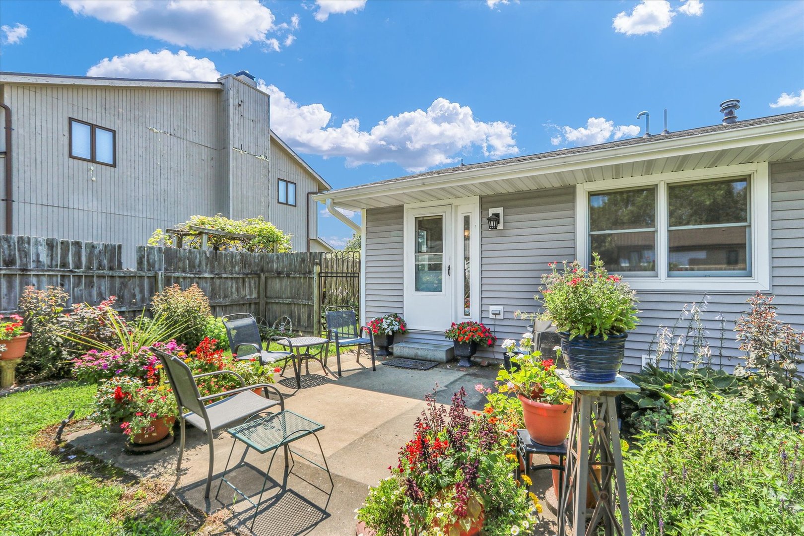 1506 Harrington Drive Champaign, IL 61821 - Photo 34 of 37 a view of a house with sitting area and potted plants