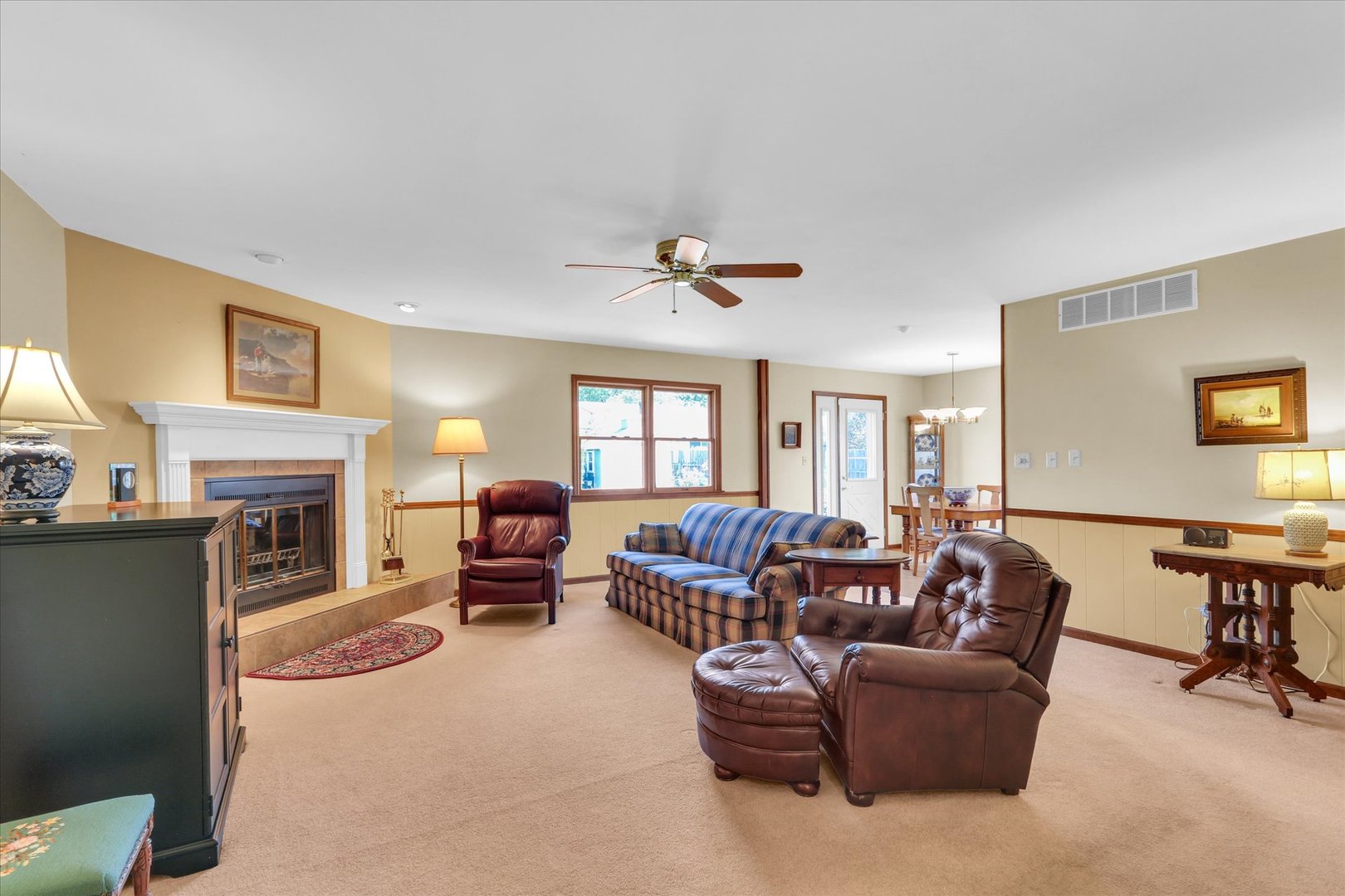 1506 Harrington Drive Champaign, IL 61821 - Photo 7 of 37 a living room with furniture a fireplace and a flat screen tv