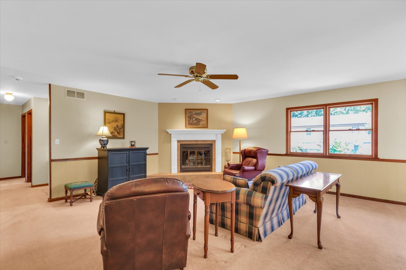 1506 Harrington Drive Champaign, IL 61821 - Photo 8 of 37 a living room with furniture a fireplace and a flat screen tv