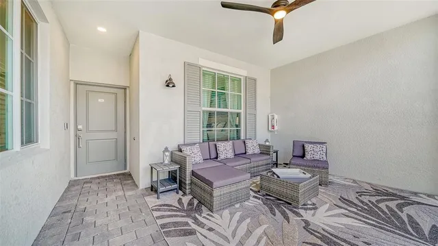 a living room with furniture and a window