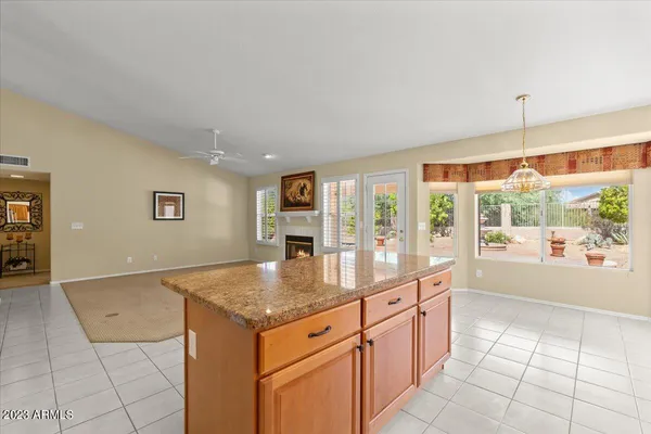 a kitchen with granite countertop a stove and a sink