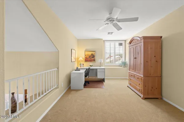 a living room with furniture and white walls