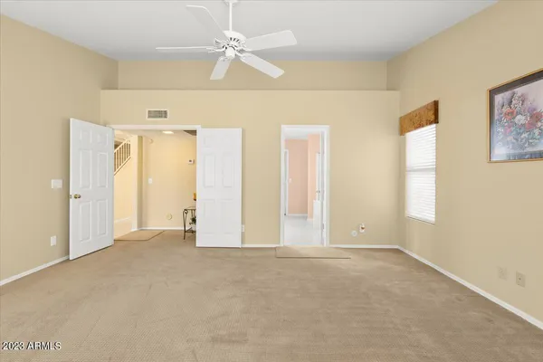 a view of an empty room with a window