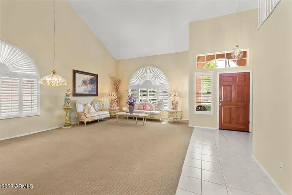 a view of a livingroom with furniture and a window