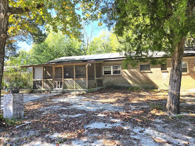 a house view with a backyard space