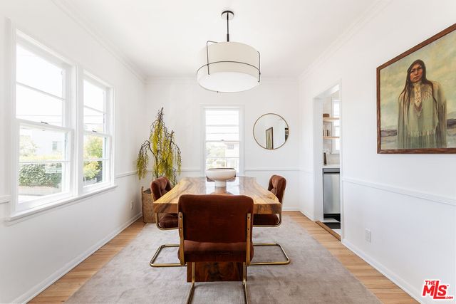 a view of a livingroom with furniture and a window