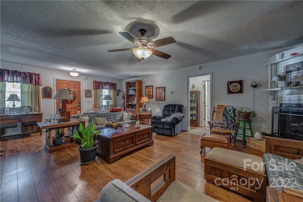5487 State Rd S-46-557 Clover, SC 29710 - Photo 11 of 32 a living room with furniture kitchen view and a large window