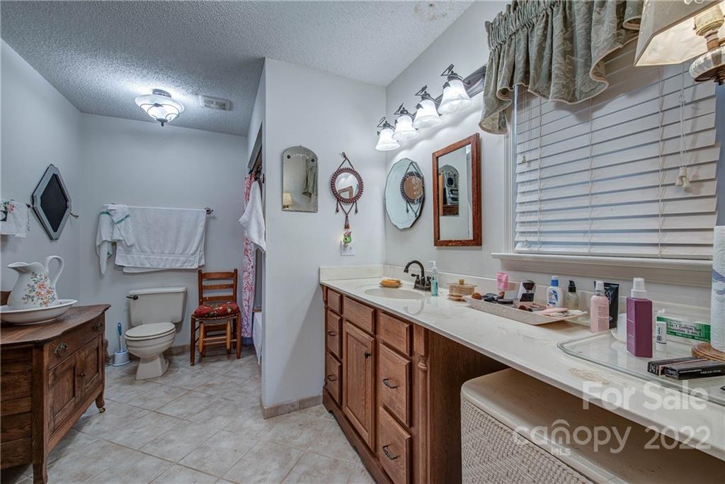 5487 State Rd S-46-557 Clover, SC 29710 - Photo 20 of 32 a kitchen with a sink and cabinets