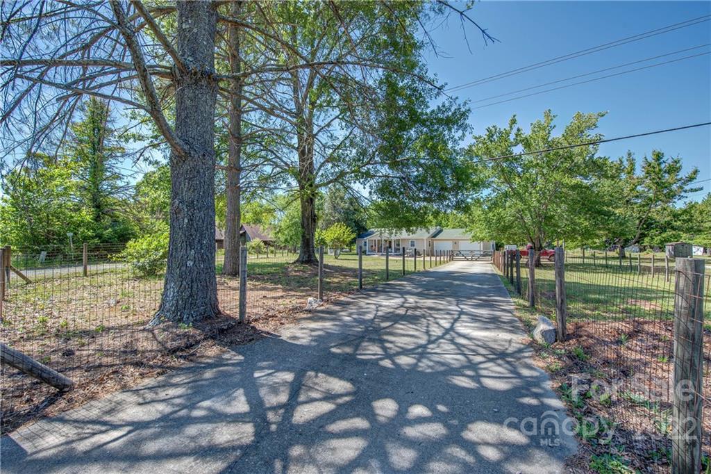 5487 State Rd S-46-557 Clover, SC 29710 - Photo 2 of 32 a backyard of a house with lots of green space