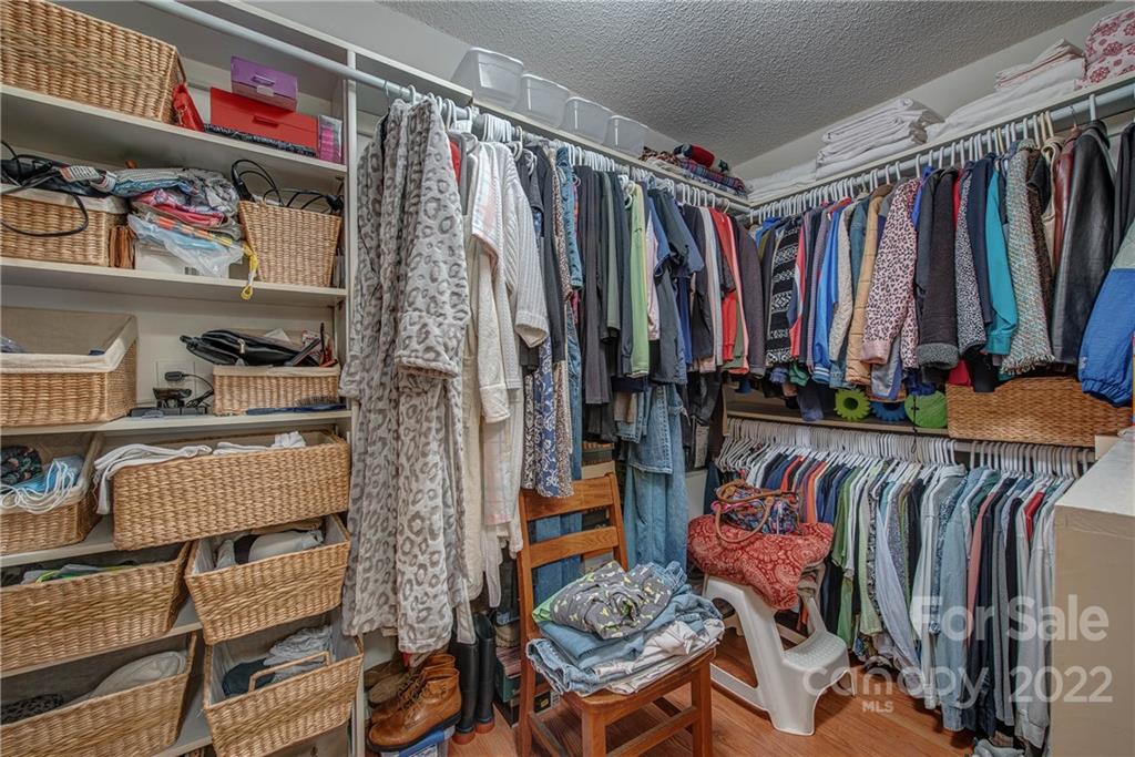5487 State Rd S-46-557 Clover, SC 29710 - Photo 21 of 32 a view of walk in closet with clothes and shoes