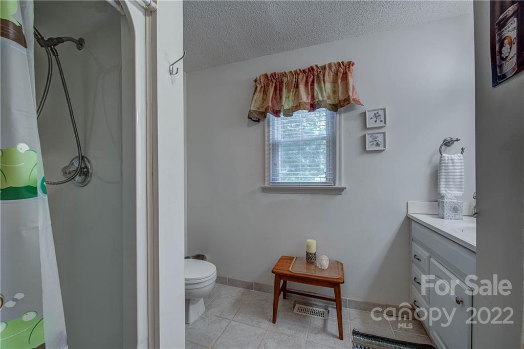 5487 State Rd S-46-557 Clover, SC 29710 - Photo 24 of 32 a bathroom with a toilet and a shower