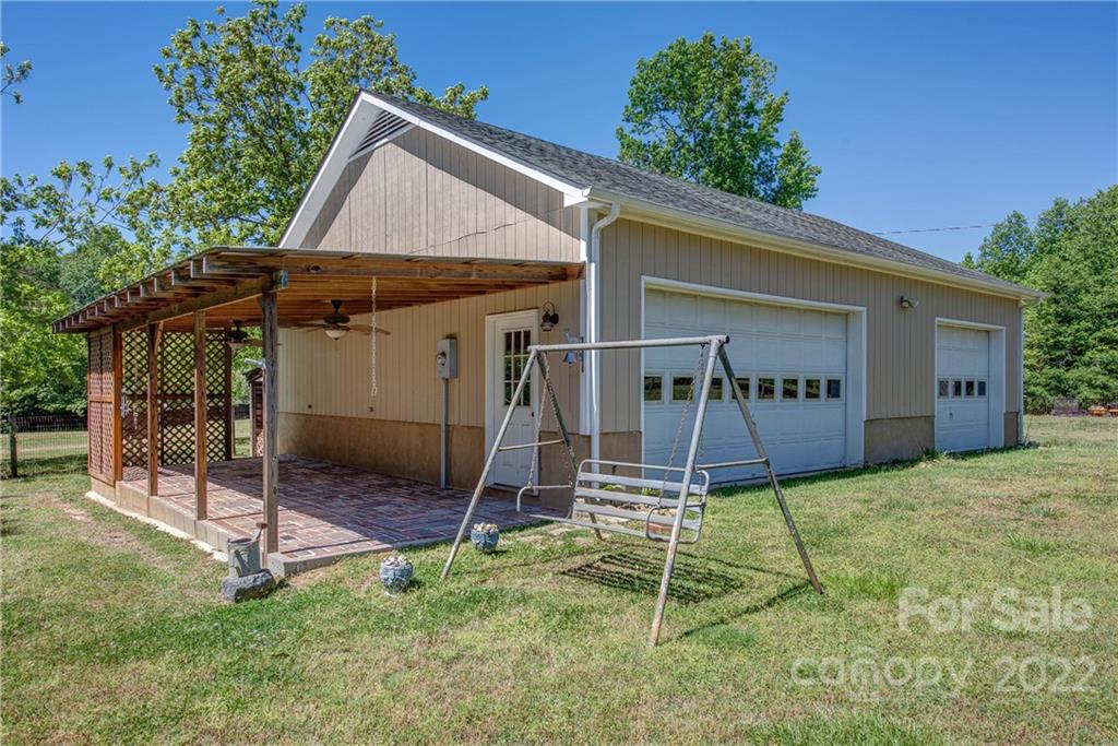 5487 State Rd S-46-557 Clover, SC 29710 - Photo 28 of 32 a backyard of a house with table and chairs