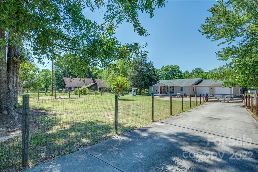 5487 State Rd S-46-557 Clover, SC 29710 - Photo 3 of 32 a view of backyard with green space