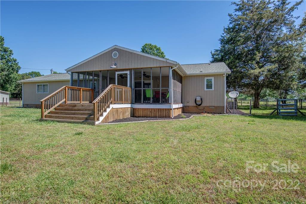 5487 State Rd S-46-557 Clover, SC 29710 - Photo 32 of 32 a front view of a house with garden