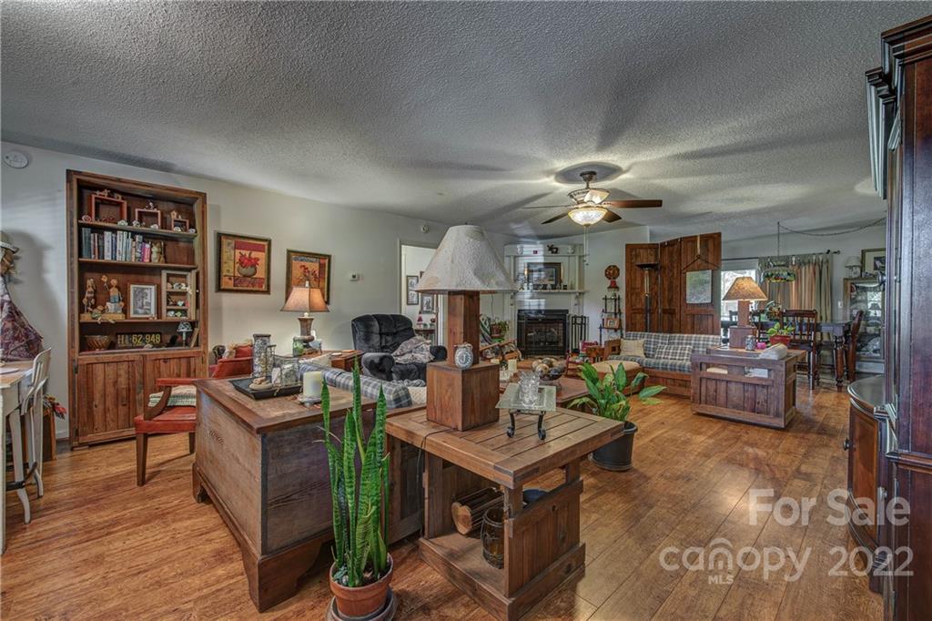 5487 State Rd S-46-557 Clover, SC 29710 - Photo 9 of 32 a view of a dining room with furniture and wooden floor