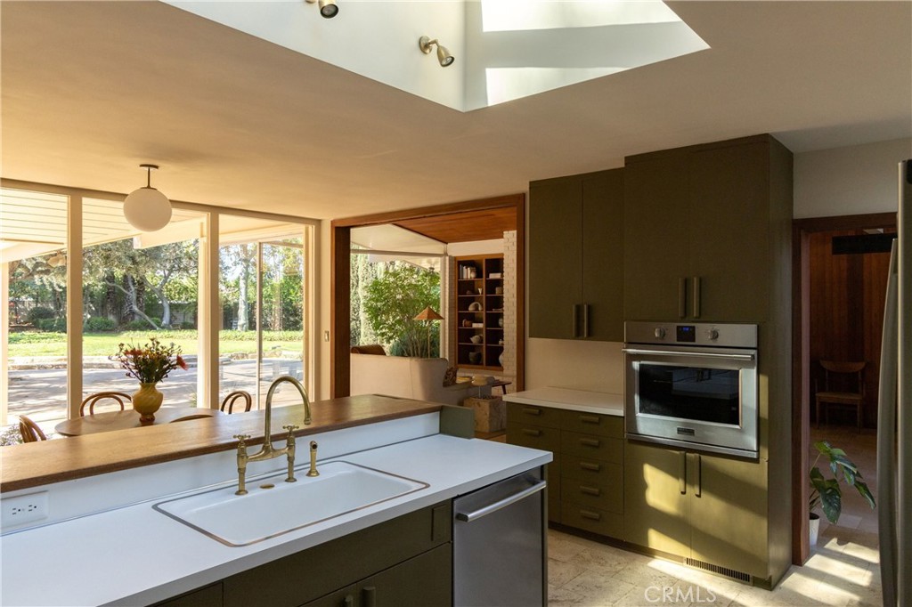 2278 Arroyo Drive Riverside, CA 92506 - Photo 25 of 75 a kitchen with a sink and a stove top oven