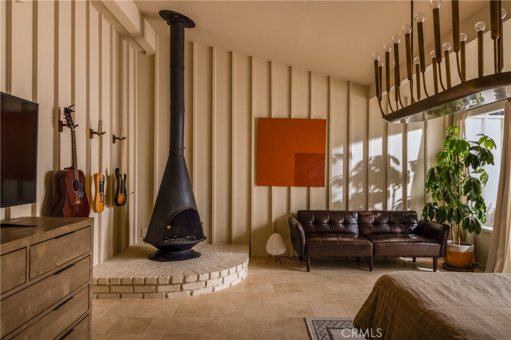 2278 Arroyo Drive Riverside, CA 92506 - Photo 36 of 75 a living room with furniture a large window and a flat screen tv