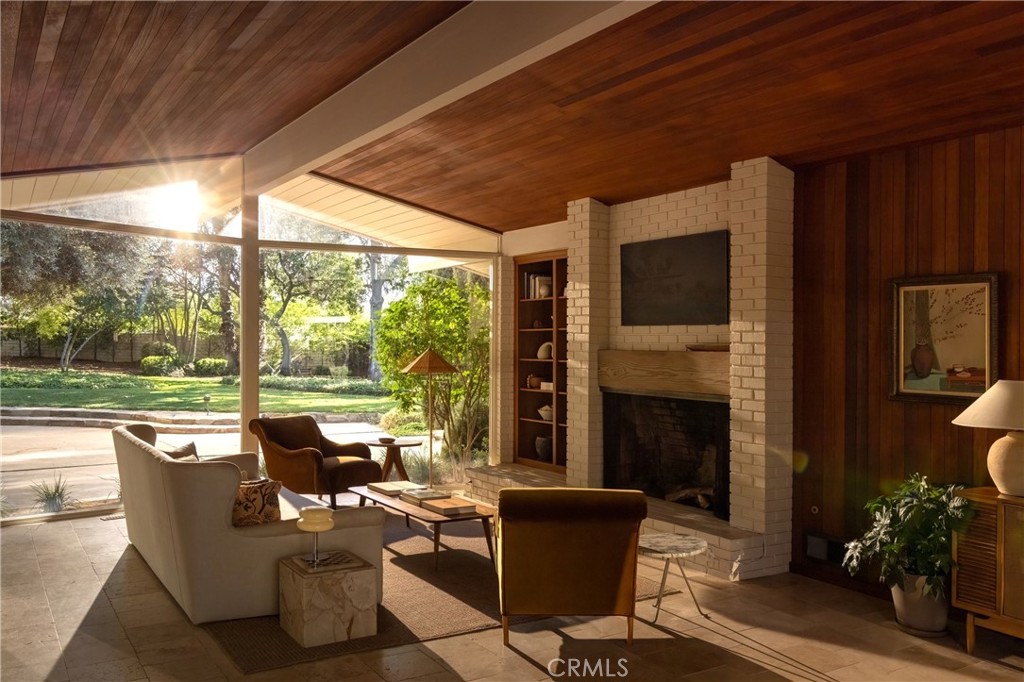 2278 Arroyo Drive Riverside, CA 92506 - Photo 39 of 75 a outdoor space with patio the couches and a fireplace with garden view