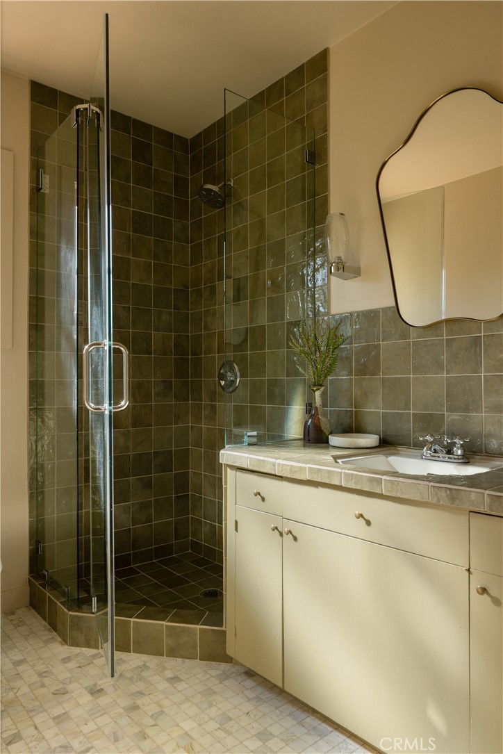 2278 Arroyo Drive Riverside, CA 92506 - Photo 42 of 75 a bathroom with a sink and a mirror