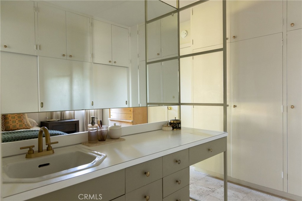 2278 Arroyo Drive Riverside, CA 92506 - Photo 50 of 75 a bathroom with a sink and mirror