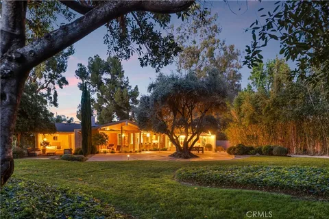 a view of house with outdoor space and yard
