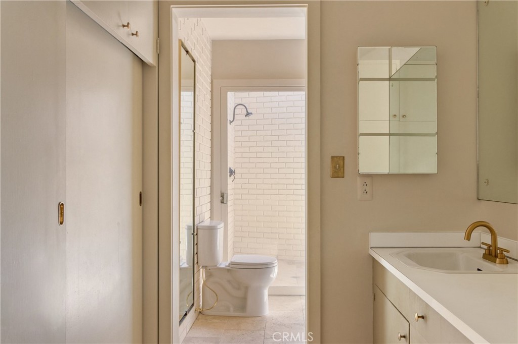 2278 Arroyo Drive Riverside, CA 92506 - Photo 53 of 75 a bathroom with a sink and a mirror