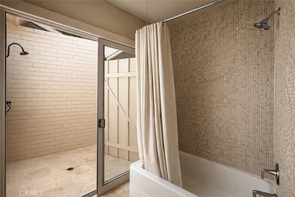 2278 Arroyo Drive Riverside, CA 92506 - Photo 54 of 75 a bathroom with a bathtub and a shower