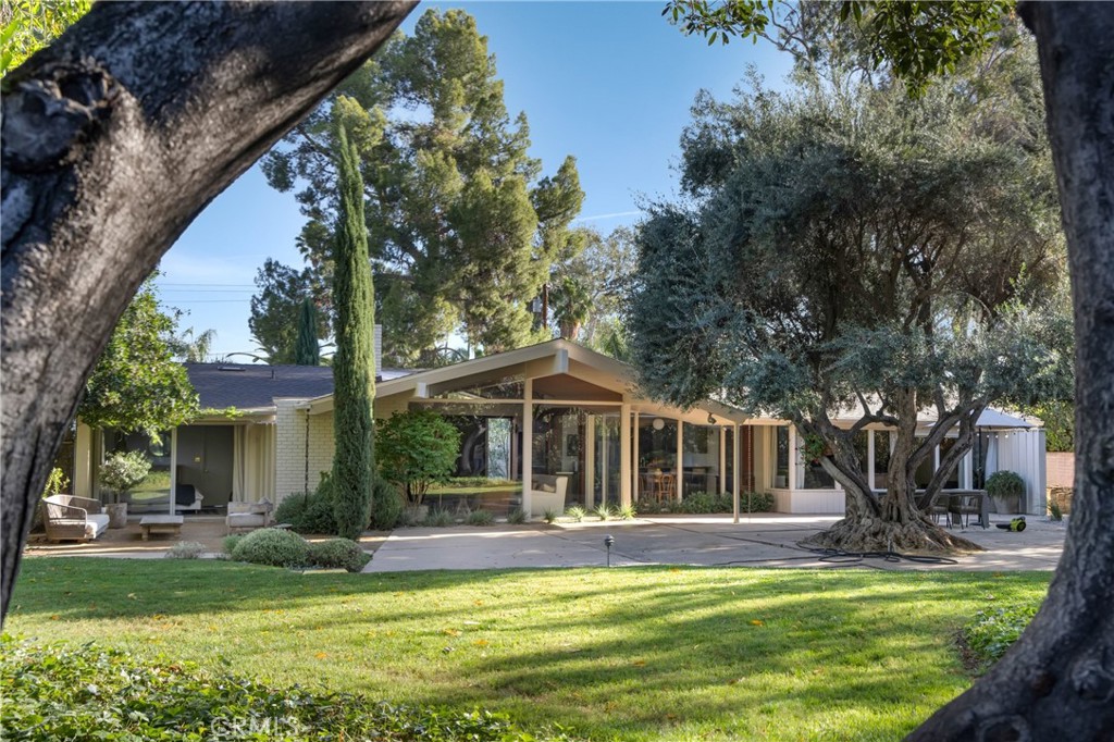 2278 Arroyo Drive Riverside, CA 92506 - Photo 59 of 75 a view of a house with swimming pool and a yard