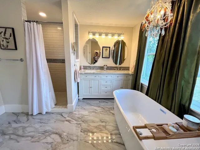 a view of living room with furniture and a flat screen tv