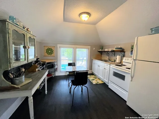 a kitchen with a sink appliances and cabinets
