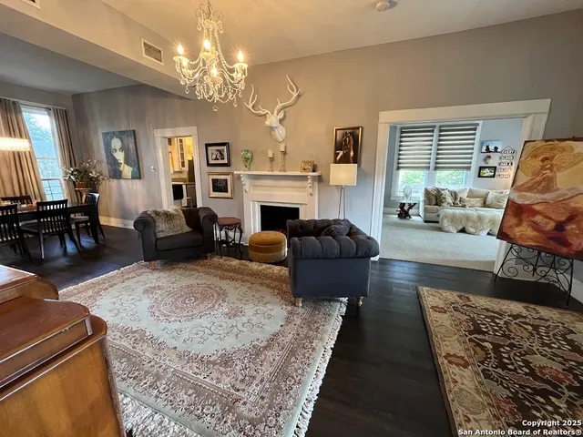 a living room with furniture fireplace and window