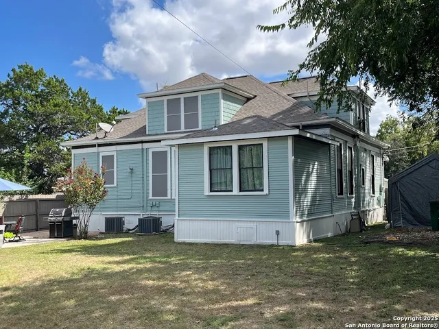 a view of a swimming pool with a yard