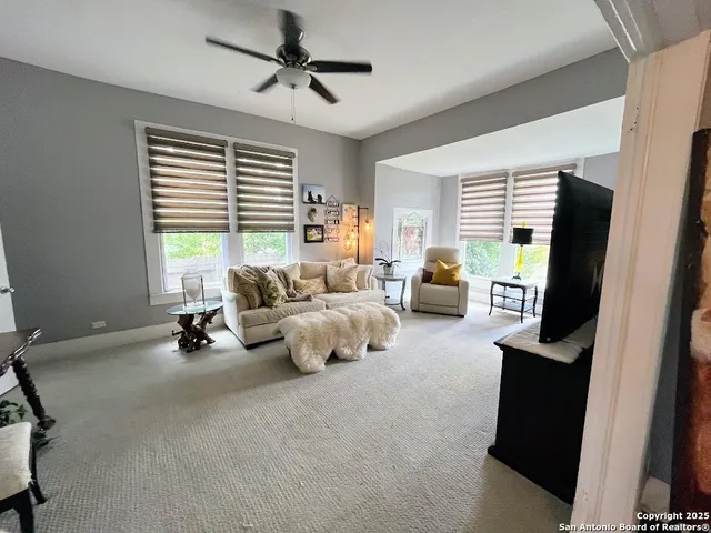 a bed room with furniture and a window